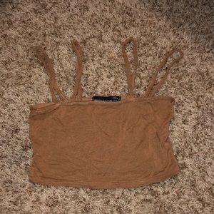 I’m selling this crop top with two straps on each side. The color is brown.